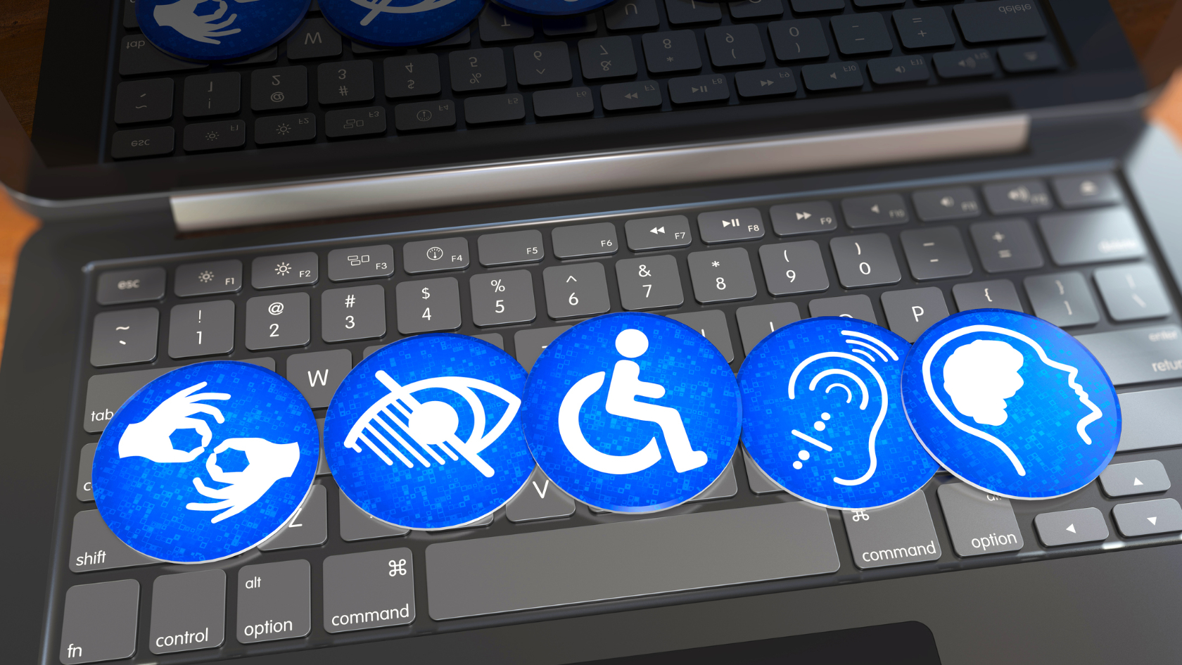 Laptop with blue stickers representing different impairments