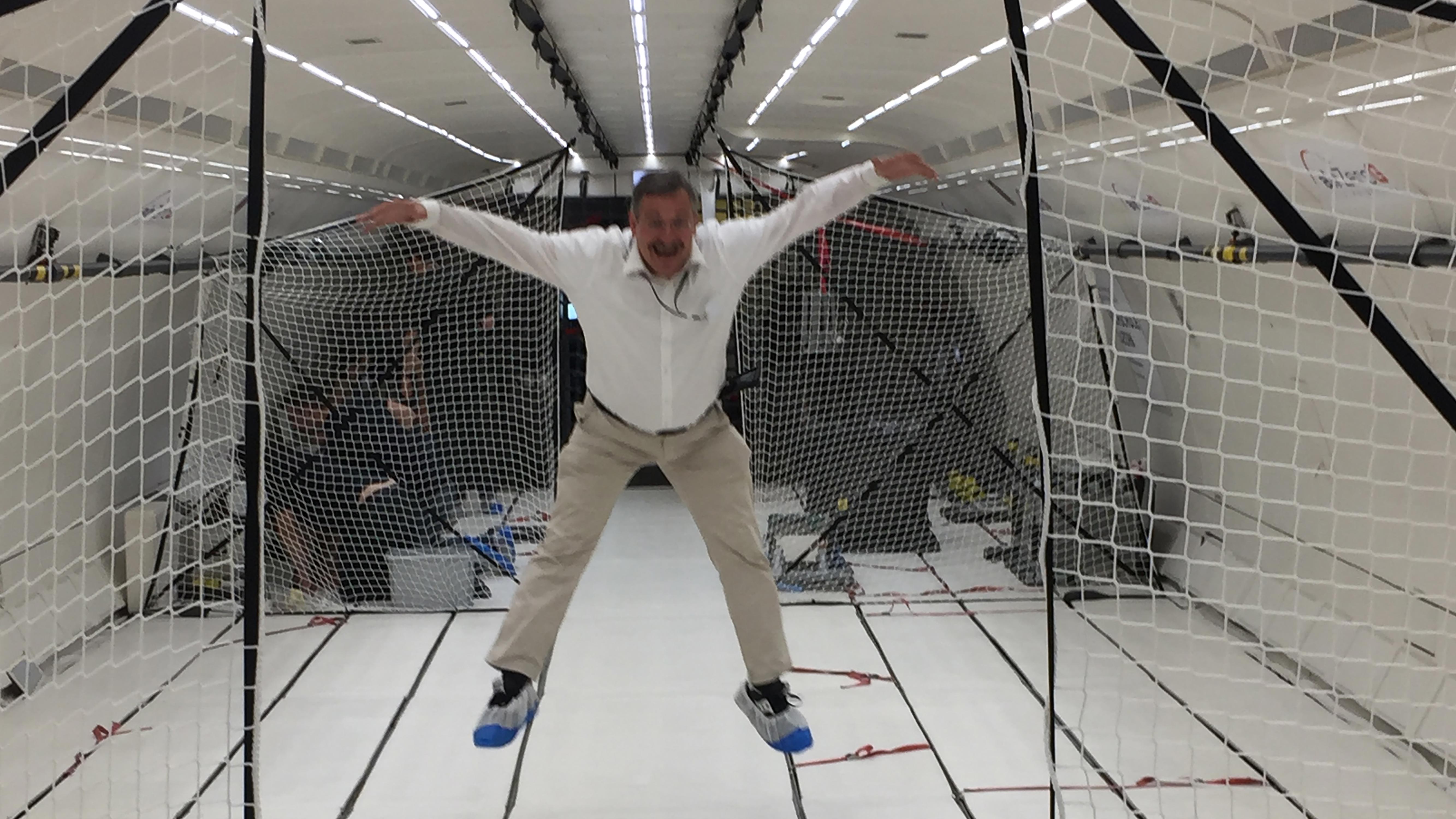 <p>Zero gravity? Not quite. In September 2018, the Executive Board of the University visited the Innovation Park in D&uuml;bendorf, where the UZH Space Hub conducts parabolic flights to research the effects of weightlessness. This picture, however, was taken with the airplane still on the ground and Michael Hengartner &ldquo;faking&rdquo; weightless for a laugh.</p> (Image: Jürg Dinner)