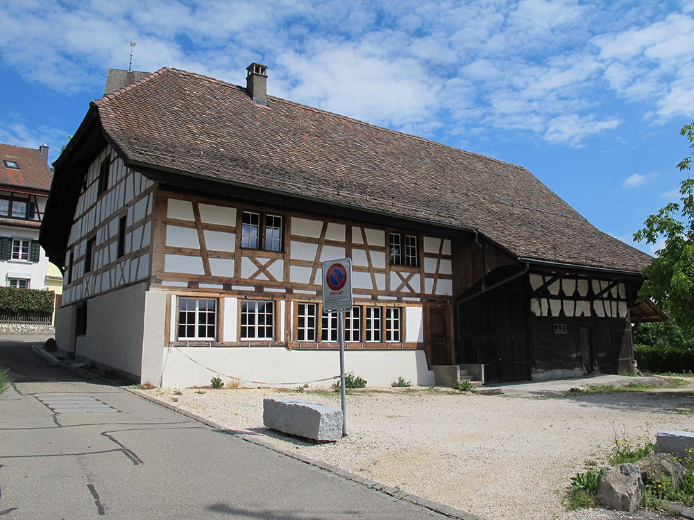 This recently renovated Dielsdorf farmhouse from the 18th century is extraordinarily well preserved. It is one of the few farmhouses in the district in which the original working and storage area of the building has not been turned into living space, meaning the huge roof is free of dormer windows, for example. It is owned by the commune and used for weddings and events. (image used with permission)